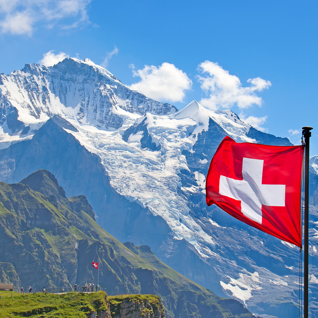 Swiss flag with mountain background