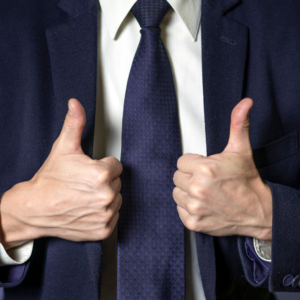 Businessperson giving two thumbs up