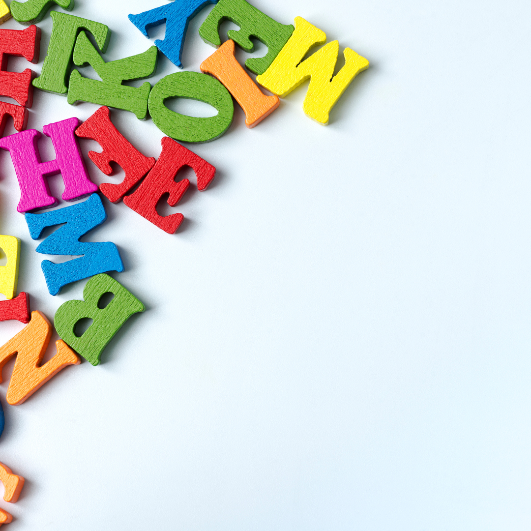 Colorful wooden alphabet letters on white background