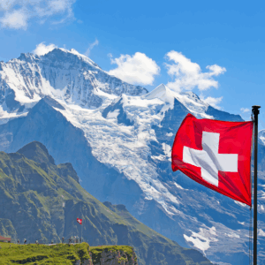 Swiss flag with snowcapped mountains background