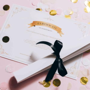 Certificate of Achievement with ribbon on pink confetti