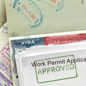 Approved U.S. work permit and visa stamps.