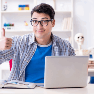 Man giving thumbs up while using laptop