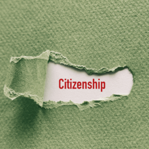 Torn green paper revealing 'Citizenship' in red.