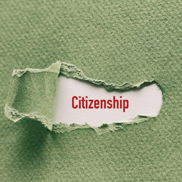 Torn green paper revealing 'Citizenship' in red.