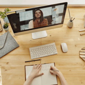 Person video conferencing while taking notes