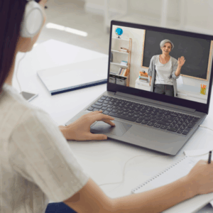 Student attending online class on laptop